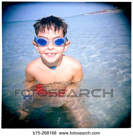 Boy playing in the water View Large Photo Image Stock Photo - Boy playing in the water. Fotosearch