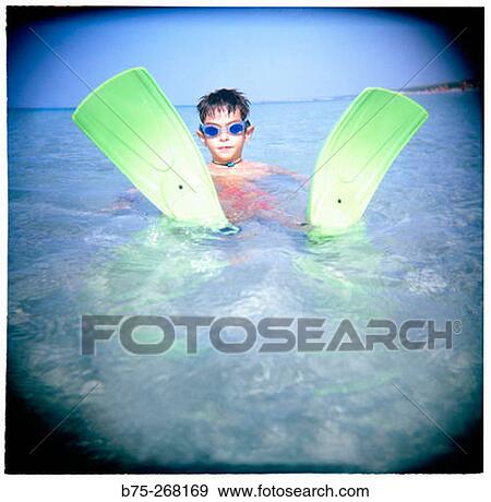 Boy playing in the water View Large Photo Image Stock Photo - Boy playing in the water. Fotosearch