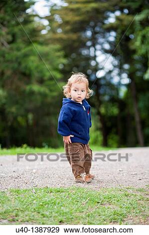 Boy playing in the woods View Large Photo Image Stock Photo - Boy playing in the woods. Fotosearch