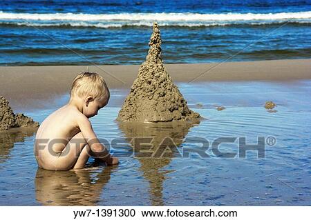 Boy playing on a Baltic Sea beach in Jantar village, Poland View Large Photo Image Stock Image - Boy playing on a Baltic Sea beach in Jantar village, Poland. Fotosearch