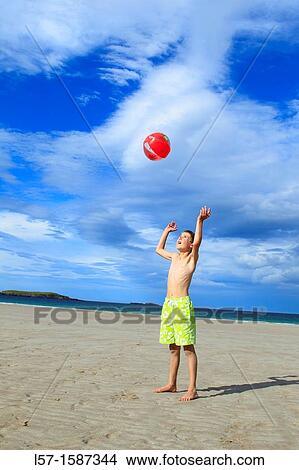 boy playing on sandy beach, Sutherland, Scotland View Large Photo Image Picture - boy playing on sandy beach, Sutherland, Scotland. Fotosearch