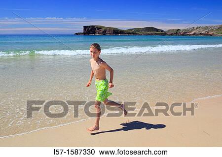 boy playing on sandy beach, Sutherland, Scotland View Large Photo Image Stock Image - boy playing on sandy beach, Sutherland, Scotland. Fotosearch