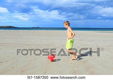 boy playing on sandy beach, Sutherland, Scotland View Large Photo Image Stock Image - boy playing on sandy beach, Sutherland, Scotland. Fotosearch