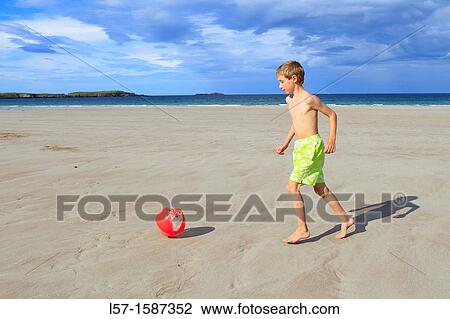 boy playing on sandy beach, Sutherland, Scotland View Large Photo Image Stock Image - boy playing on sandy beach, Sutherland, Scotland. Fotosearch