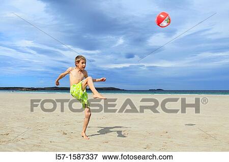 boy playing on sandy beach, Sutherland, Scotland View Large Photo Image Stock Photo - boy playing on sandy beach, Sutherland, Scotland. Fotosearch