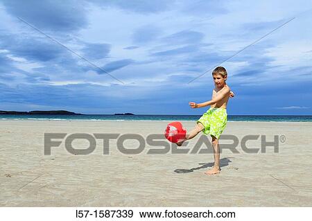 boy playing on sandy beach, Sutherland, Scotland View Large Photo Image Stock Photo - boy playing on sandy beach, Sutherland, Scotland. Fotosearch