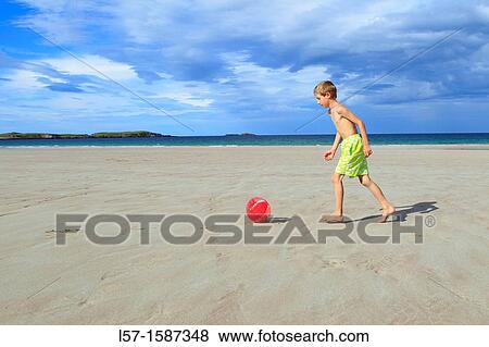 boy playing on sandy beach, Sutherland, Scotland View Large Photo Image Stock Photo - boy playing on sandy beach, Sutherland, Scotland. Fotosearch