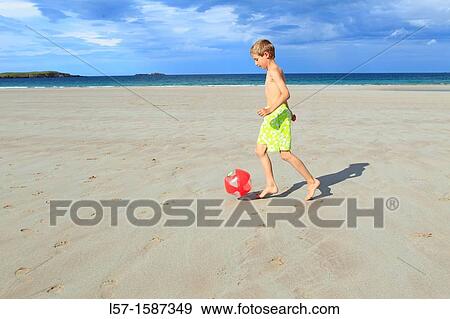 boy playing on sandy beach, Sutherland, Scotland View Large Photo Image Stock Photo - boy playing on sandy beach, Sutherland, Scotland. Fotosearch