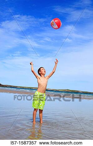 boy playing on sandy beach, Sutherland, Scotland View Large Photo Image Stock Photo - boy playing on sandy beach, Sutherland, Scotland. Fotosearch