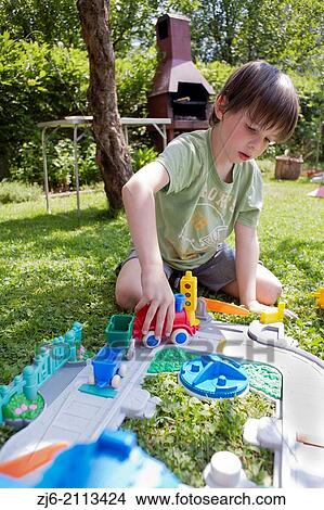 Boy playing outdoor. View Large Photo Image Picture - Boy playing outdoor.. Fotosearch