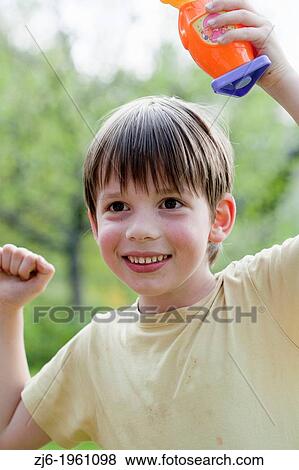 Stock Photo - Boy playing outdoor.. Fotosearch