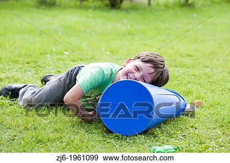 Stock Photo - Boy playing outdoor.. Fotosearch