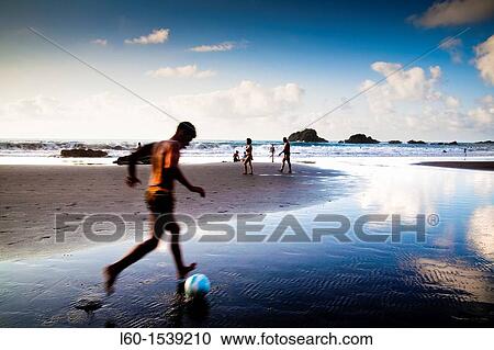boy playing soccer in the beach, San Roque beach, Tenerife, Canary Islands, Spain View Large Photo Image Stock Image - boy playing soccer in the beach, San Roque beach, Tenerife, Canary Islands, Spain. Fotosearch