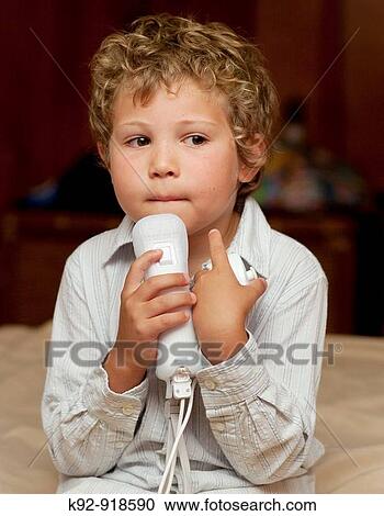 Boy playing the Wii View Large Photo Image Stock Image - Boy playing the Wii. Fotosearch