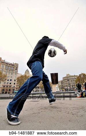 Boy playing with a ball, Pla? a de Catalunya, Barcelona, Catalonia, Spain View Large Photo Image Stock Photo - Boy playing with a ball, Pla? a de Catalunya, Barcelona, Catalonia, Spain. Fotosearch