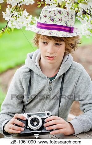 Boy playing with an old camera. View Large Photo Image Stock Image - Boy playing with an old camera.. Fotosearch