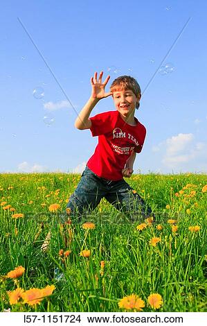 boy playing with bubbles in field of Dandelions, Zuercher Oberland, Zuerich, Switzerland View Large Photo Image Picture - boy playing with bubbles in field of Dandelions, Zuercher Oberland, Zuerich, Switzerland. Fotosearch