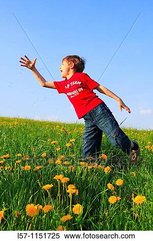 boy playing with bubbles in field of Dandelions, Zuercher Oberland, Zuerich, Switzerland View Large Photo Image Stock Photography - boy playing with bubbles in field of Dandelions, Zuercher Oberland, Zuerich, Switzerland. Fotosearch