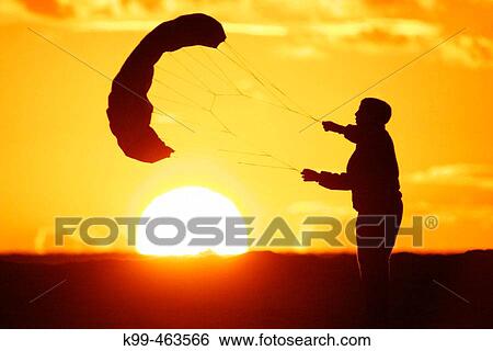 Boy playing with kite at sunset. Tarifa, CBdiz province. Andalusia, Spain View Large Photo Image Stock Photograph - Boy playing with kite at sunset. Tarifa, CBdiz province. Andalusia, Spain. Fotosearch