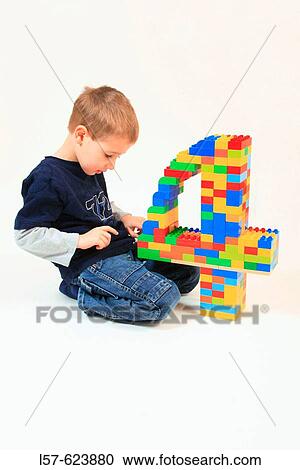boy playing with toy, Lego, on his fourth birthday, Studio, Oetwil am See, Zuerich, Switzerland, View Large Photo Image Stock Image - boy playing with toy, Lego, on his fourth birthday, Studio, Oetwil am See, Zuerich, Switzerland,. Fotosearch