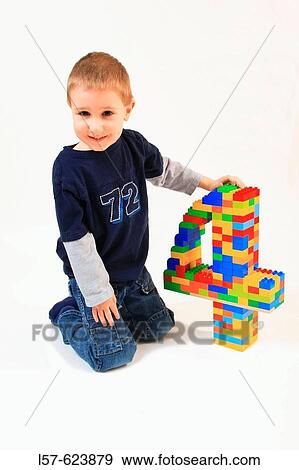 boy playing with toy, Lego, on his fourth birthday, Studio, Oetwil am See, Zuerich, Switzerland, View Large Photo Image Stock Photo - boy playing with toy, Lego, on his fourth birthday, Studio, Oetwil am See, Zuerich, Switzerland,. Fotosearch