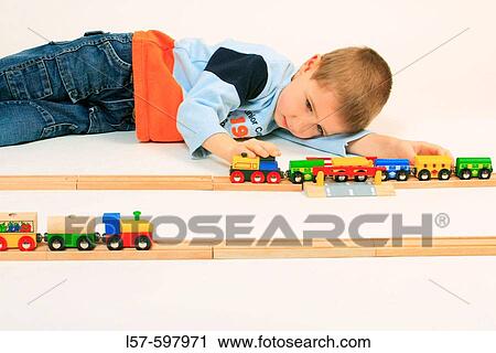boy playing with toy, toy railway, studio, Oetwil am See, Zuerich, Switzerland View Large Photo Image Stock Image - boy playing with toy, toy railway, studio, Oetwil am See, Zuerich, Switzerland. Fotosearch