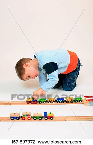 boy playing with toy, toy railway, studio, Oetwil am See, Zuerich, Switzerland View Large Photo Image Stock Image - boy playing with toy, toy railway, studio, Oetwil am See, Zuerich, Switzerland. Fotosearch