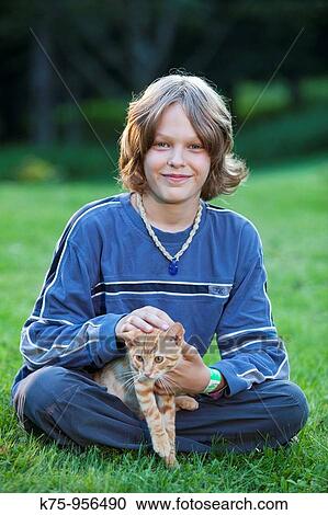 Stock Image - boy portrait with kitten. Fotosearch