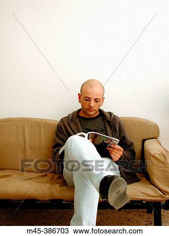 Boy reading magazine View Large Photo Image Stock Image - Boy reading magazine. Fotosearch