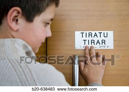 Boy reading sign in Braille system at Kursaal Center. San Sebastian, Guipuzcoa, Euskadi, Spain View Large Photo Image Stock Image - Boy reading sign in Braille system at Kursaal Center. San Sebastian, Guipuzcoa, Euskadi, Spain. Fotosearch