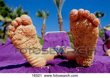 Boy relaxing at the beach View Large Photo Image Stock Image - Boy relaxing at the beach. Fotosearch
