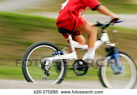 Boy riding a bicycle View Large Photo Image Stock Photography - Boy riding a bicycle. Fotosearch