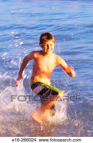 boy running at ocean View Large Photo Image Picture - boy running at ocean. Fotosearch