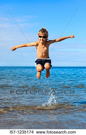 boy running on sandy beach, Sutherland, Scotland View Large Photo Image Picture - boy running on sandy beach, Sutherland, Scotland. Fotosearch