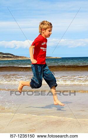 boy running on sandy beach, Sutherland, Scotland View Large Photo Image Stock Image - boy running on sandy beach, Sutherland, Scotland. Fotosearch