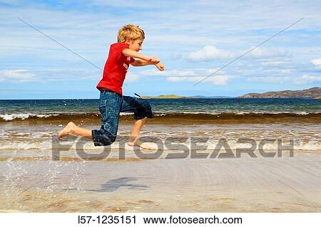 boy running on sandy beach, Sutherland, Scotland View Large Photo Image Stock Image - boy running on sandy beach, Sutherland, Scotland. Fotosearch