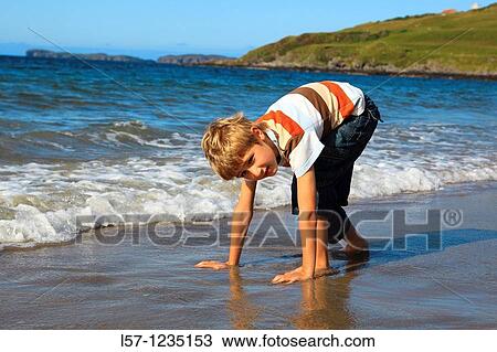 boy running on sandy beach, Sutherland, Scotland View Large Photo Image Stock Image - boy running on sandy beach, Sutherland, Scotland. Fotosearch