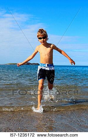 boy running on sandy beach, Sutherland, Scotland View Large Photo Image Stock Image - boy running on sandy beach, Sutherland, Scotland. Fotosearch