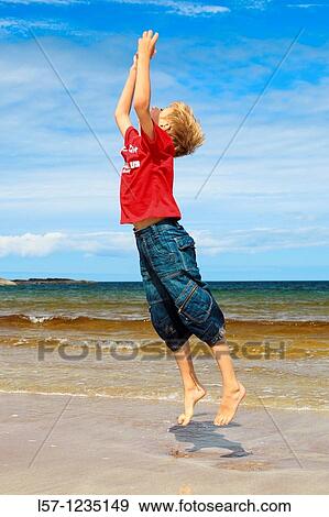 boy running on sandy beach, Sutherland, Scotland View Large Photo Image Stock Photo - boy running on sandy beach, Sutherland, Scotland. Fotosearch