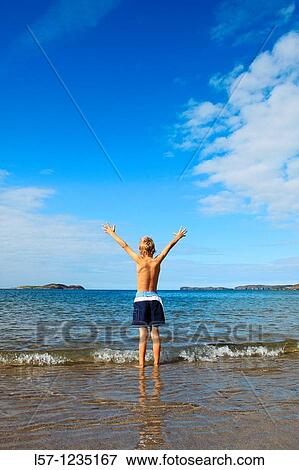 boy running on sandy beach, Sutherland, Scotland View Large Photo Image Stock Photo - boy running on sandy beach, Sutherland, Scotland. Fotosearch