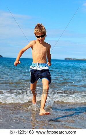 boy running on sandy beach, Sutherland, Scotland View Large Photo Image Stock Photo - boy running on sandy beach, Sutherland, Scotland. Fotosearch