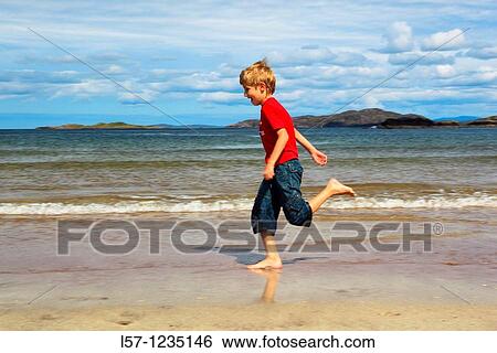 boy running on sandy beach, Sutherland, Scotland View Large Photo Image Stock Photograph - boy running on sandy beach, Sutherland, Scotland. Fotosearch