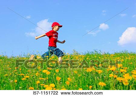 boy running through field of Dandelions, Zuercher Oberland, Zuerich, Switzerland View Large Photo Image Stock Image - boy running through field of Dandelions, Zuercher Oberland, Zuerich, Switzerland. Fotosearch