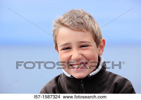 boy sitting on seacoast View Large Photo Image Picture - boy sitting on seacoast. Fotosearch
