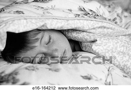 Boy sleeping in bed View Large Photo Image Stock Image - Boy sleeping in bed. Fotosearch