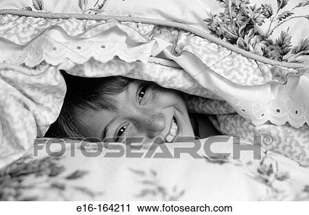 Boy smiling in bed View Large Photo Image Stock Image - Boy smiling in bed. Fotosearch