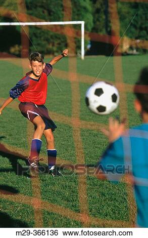 Stock Photograph - Boy soccer.. Fotosearch
