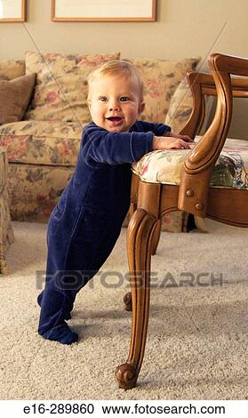 boy starting to stand up View Large Photo Image Stock Image - boy starting to stand up. Fotosearch