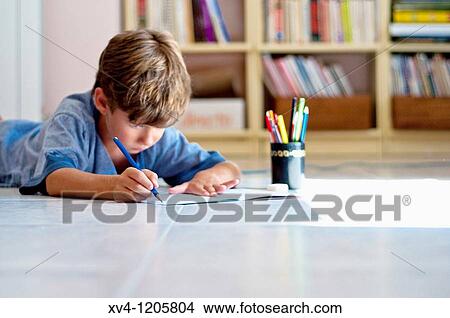 Boy studing at home View Large Photo Image Picture - Boy studing at home. Fotosearch