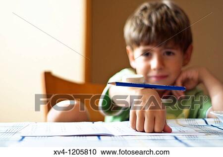 Boy studing at home View Large Photo Image Stock Image - Boy studing at home. Fotosearch